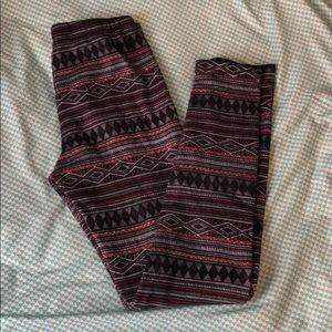 Red and black Aztec patterned pants